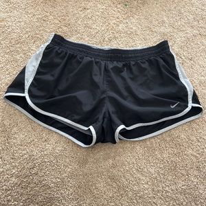 Nike dry fit women’s shorts in the size XL, black and grey.